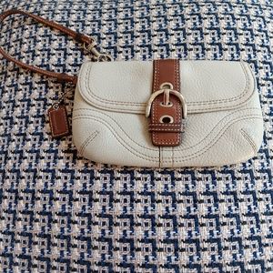 Coach cream & brown leather wristlet.
